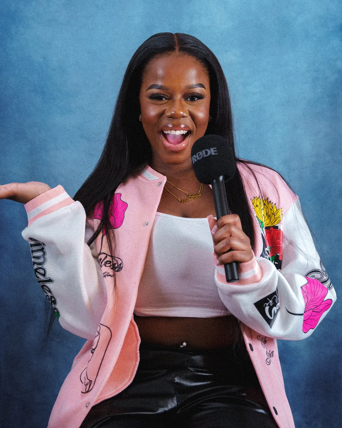 Miss Tee Moyo making heart sign